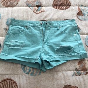 Mint blue distressed jean shorts